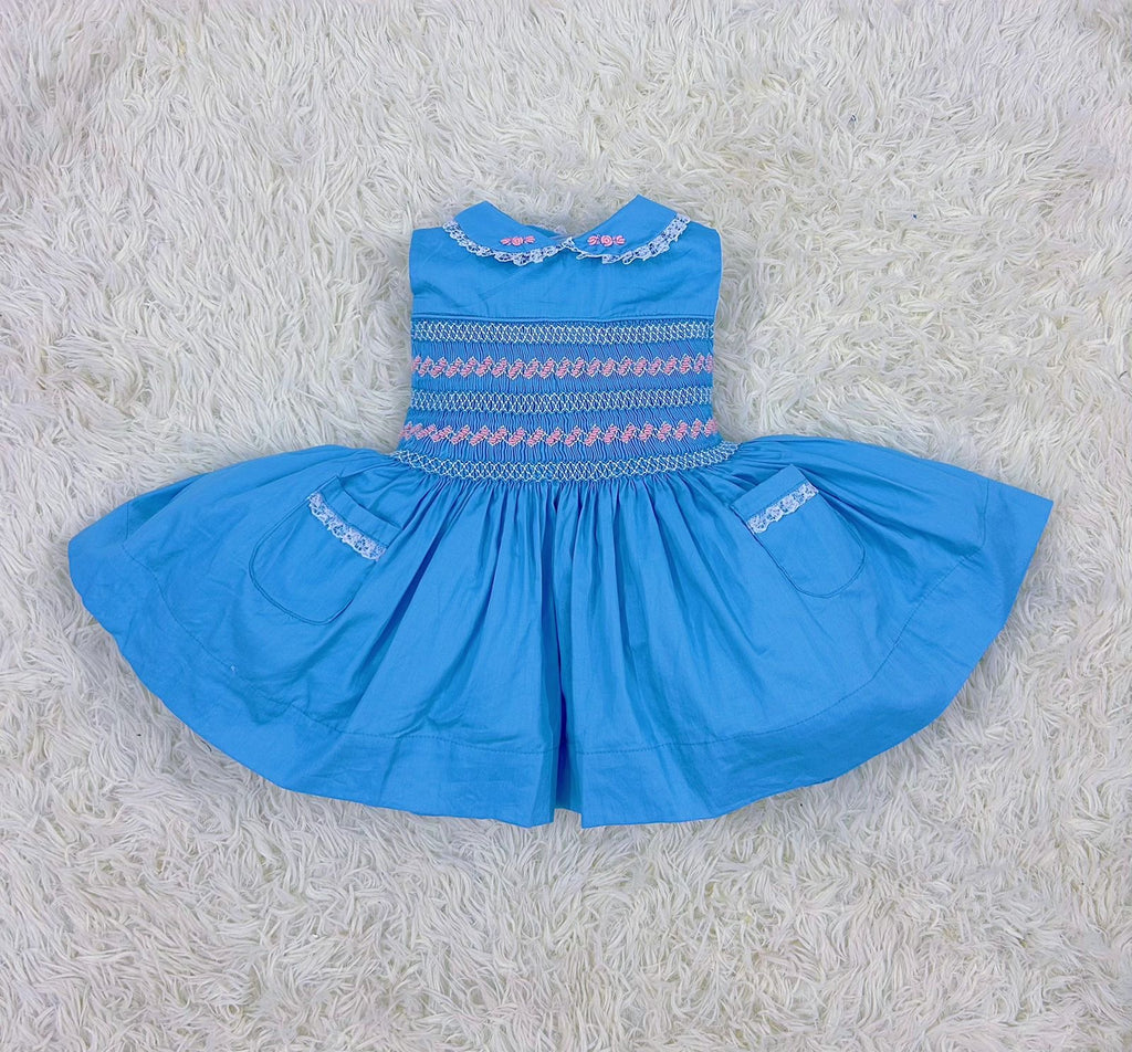Blue “Francis” Handsmocked sleeveless frock.