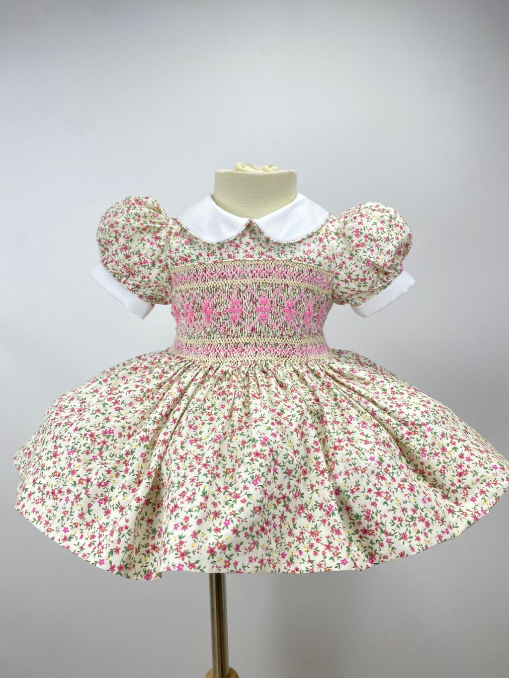 Cream “Florence” Floral Handsmocked Frock.