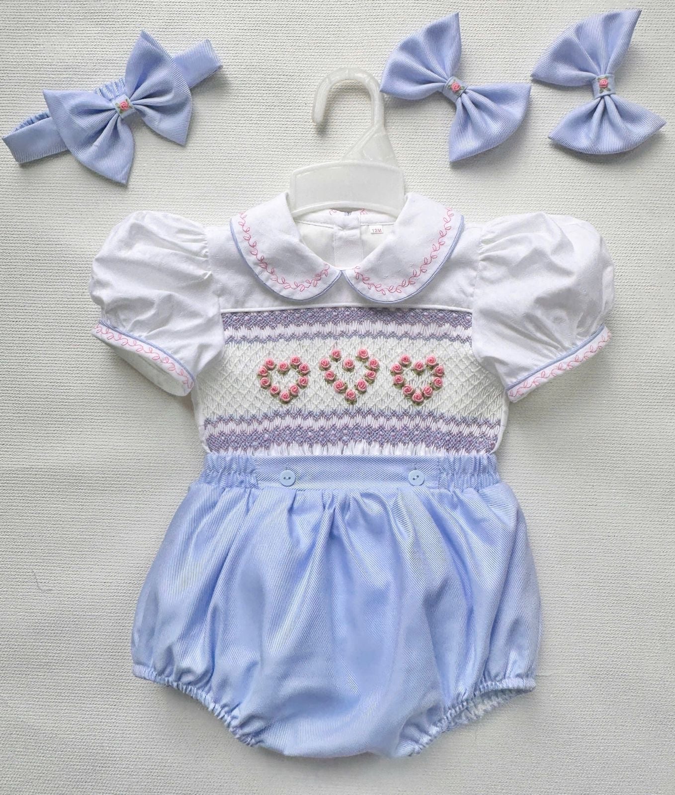 Blue “Lillie” Handsmocked Romper.