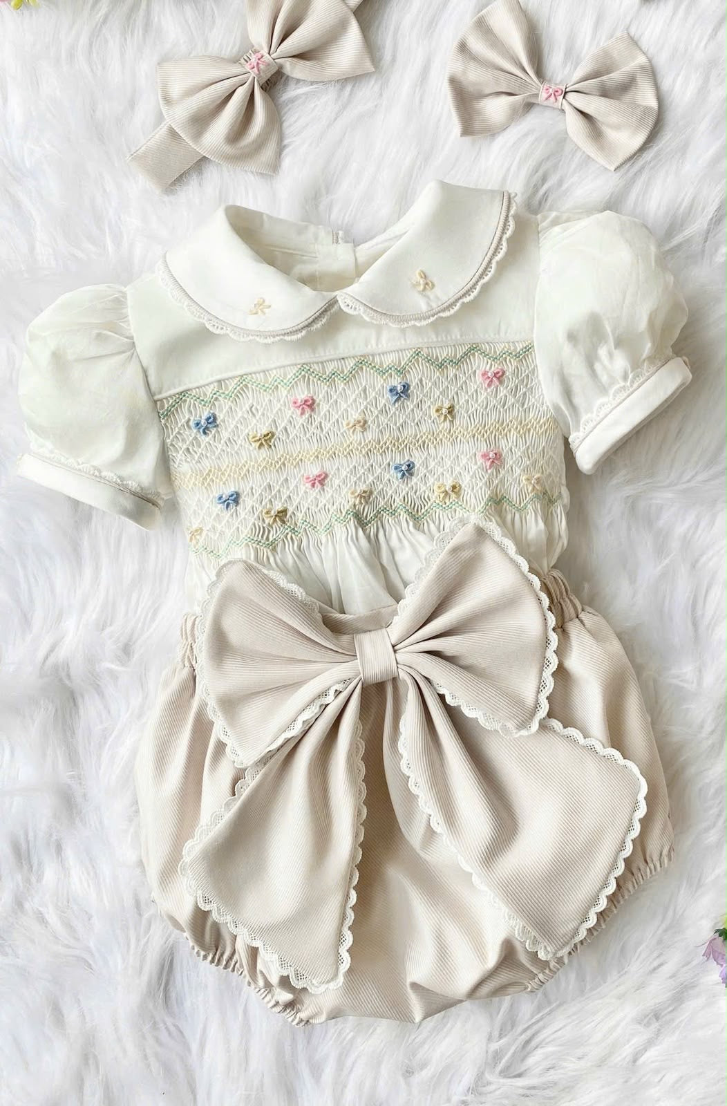 Cream “Vanilla” handsmocked romper. 🍨 (Two week pre order)