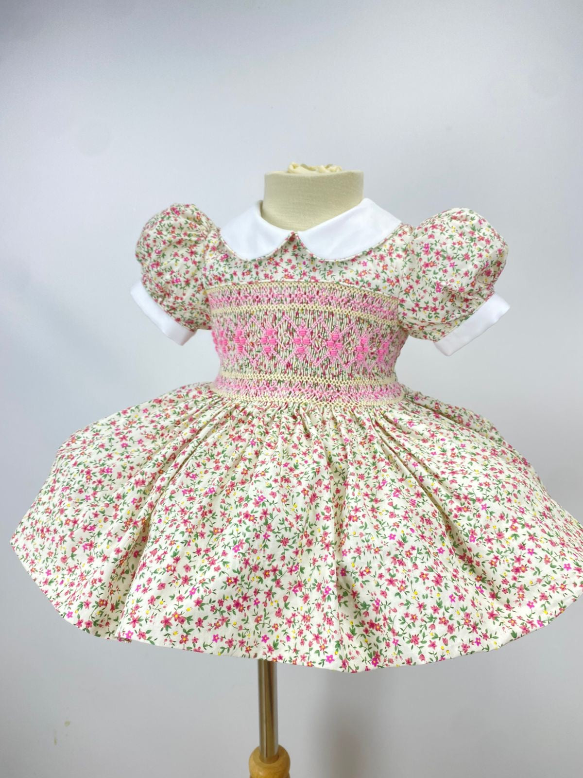 Cream “Florence” Floral Handsmocked Frock.