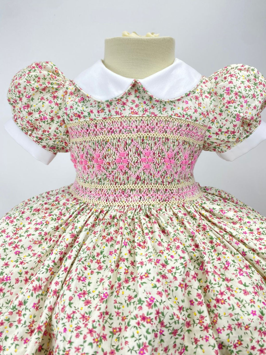 Cream “Florence” Floral Handsmocked Frock.