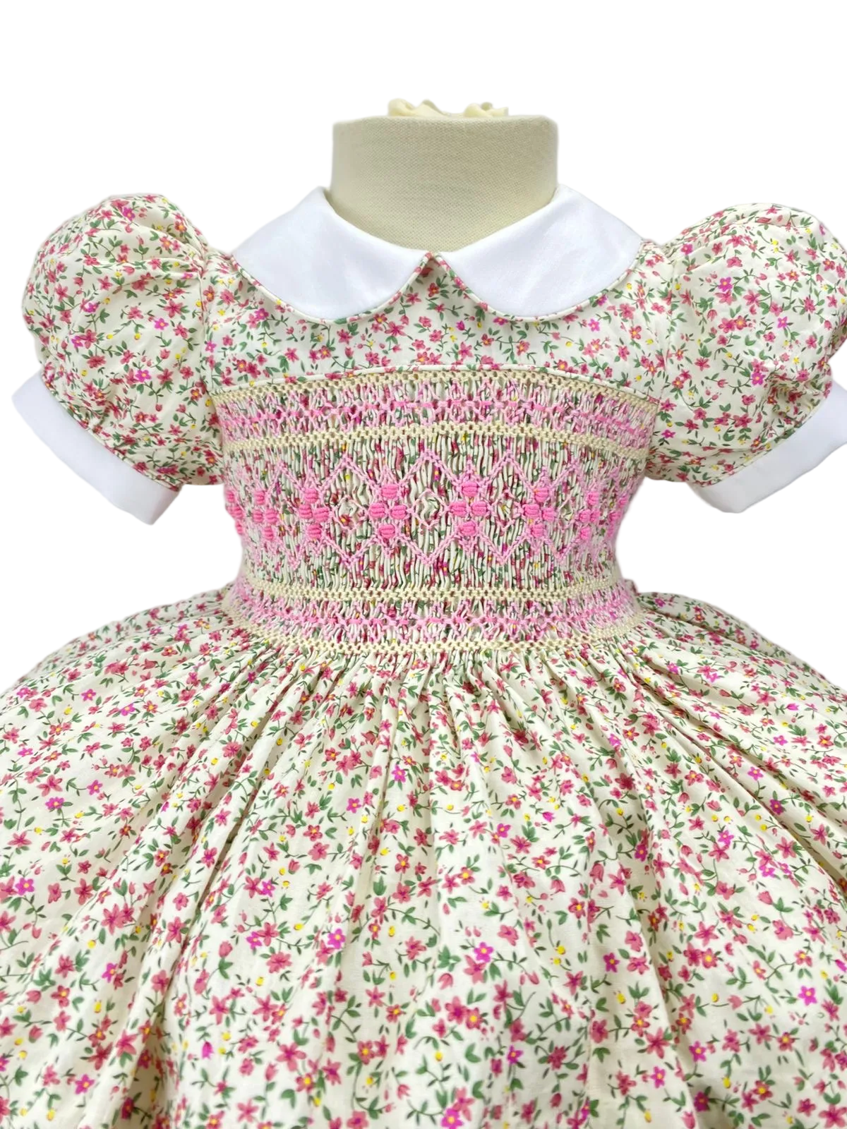 Cream “Florence” Floral Handsmocked Frock.
