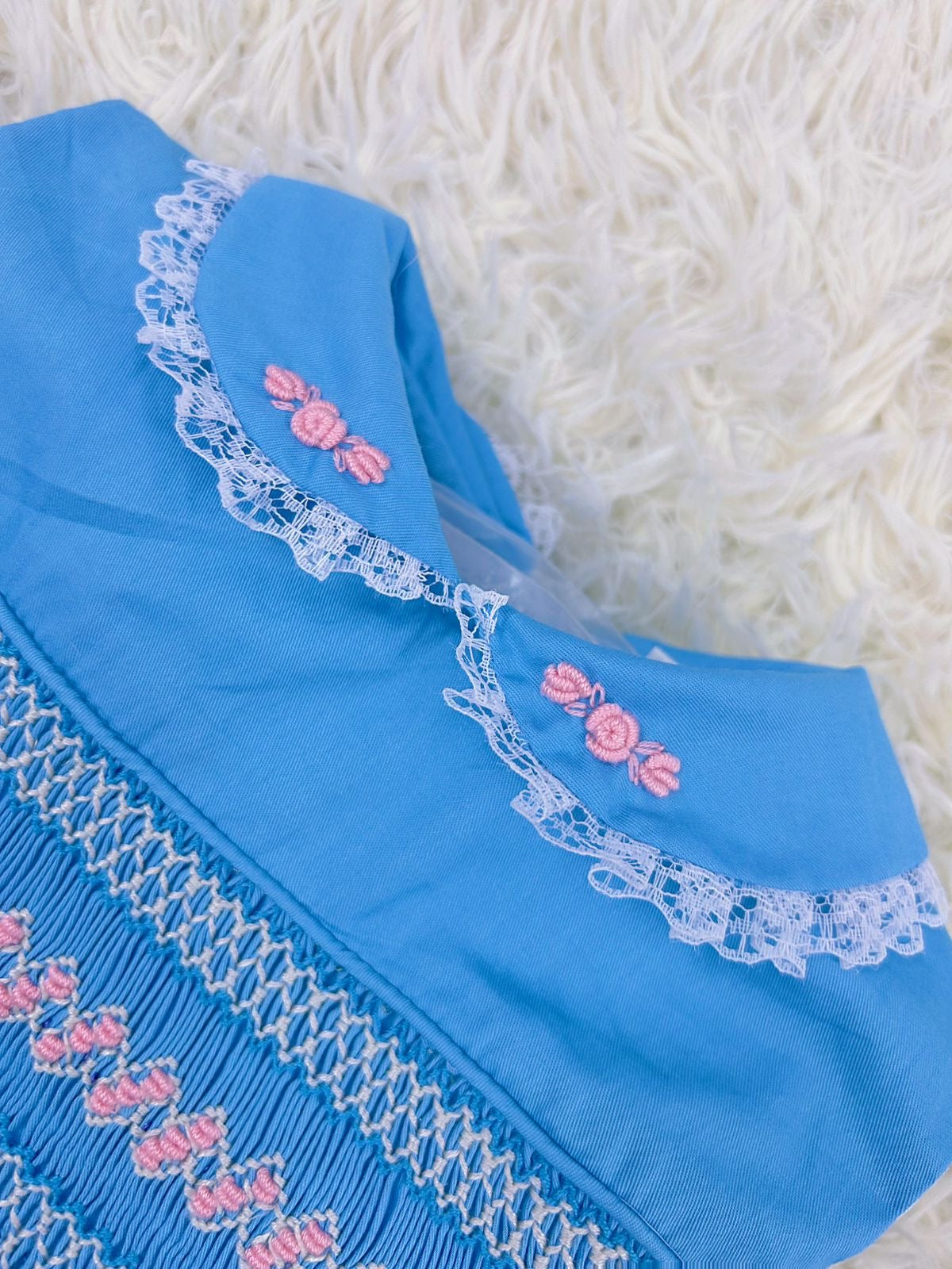 Blue “Francis” Handsmocked sleeveless frock.