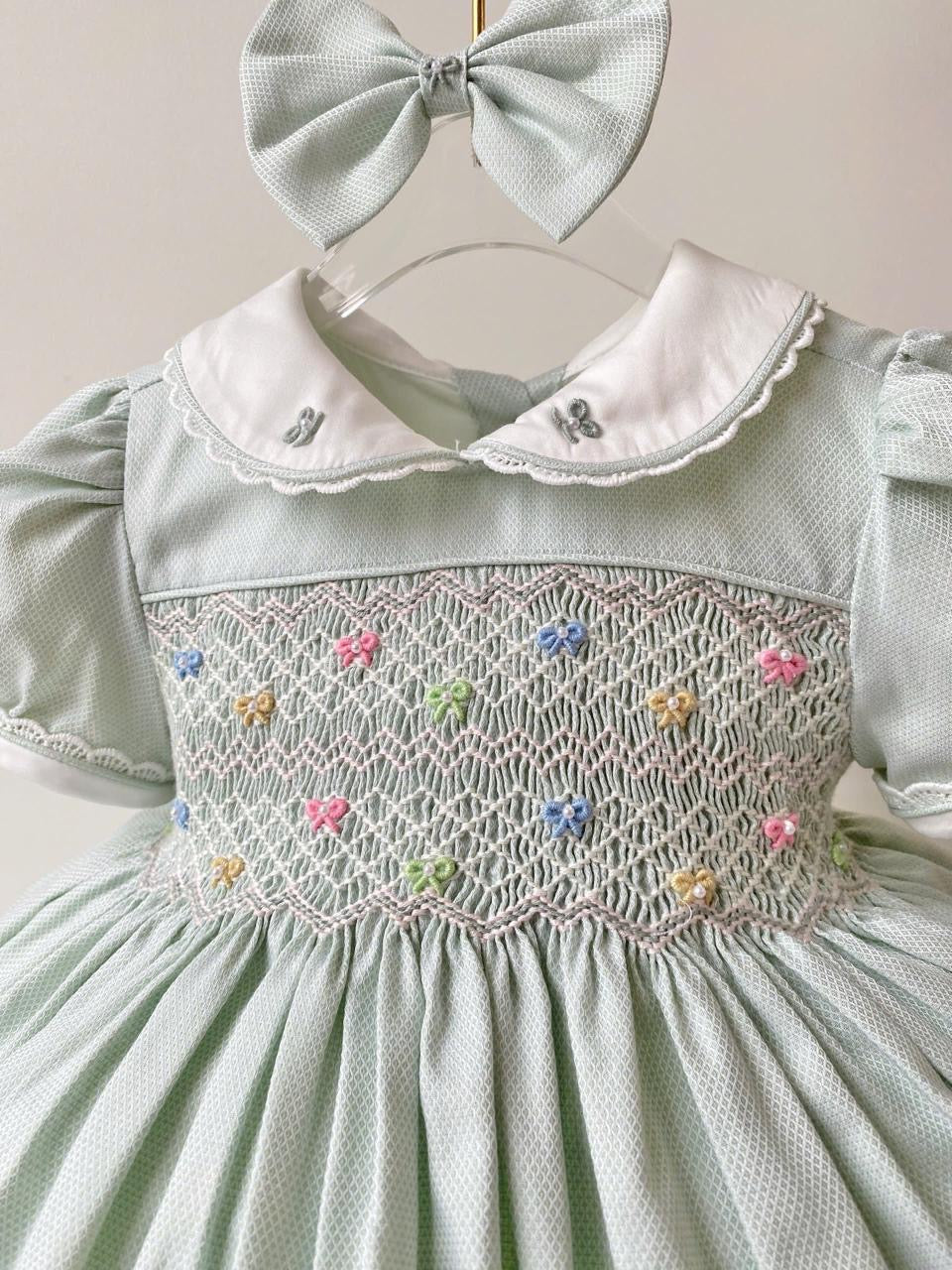 Sage/Grey “Blondie” handsmocked frock. (Bows and Bloomers to match) 10 day dispatch)