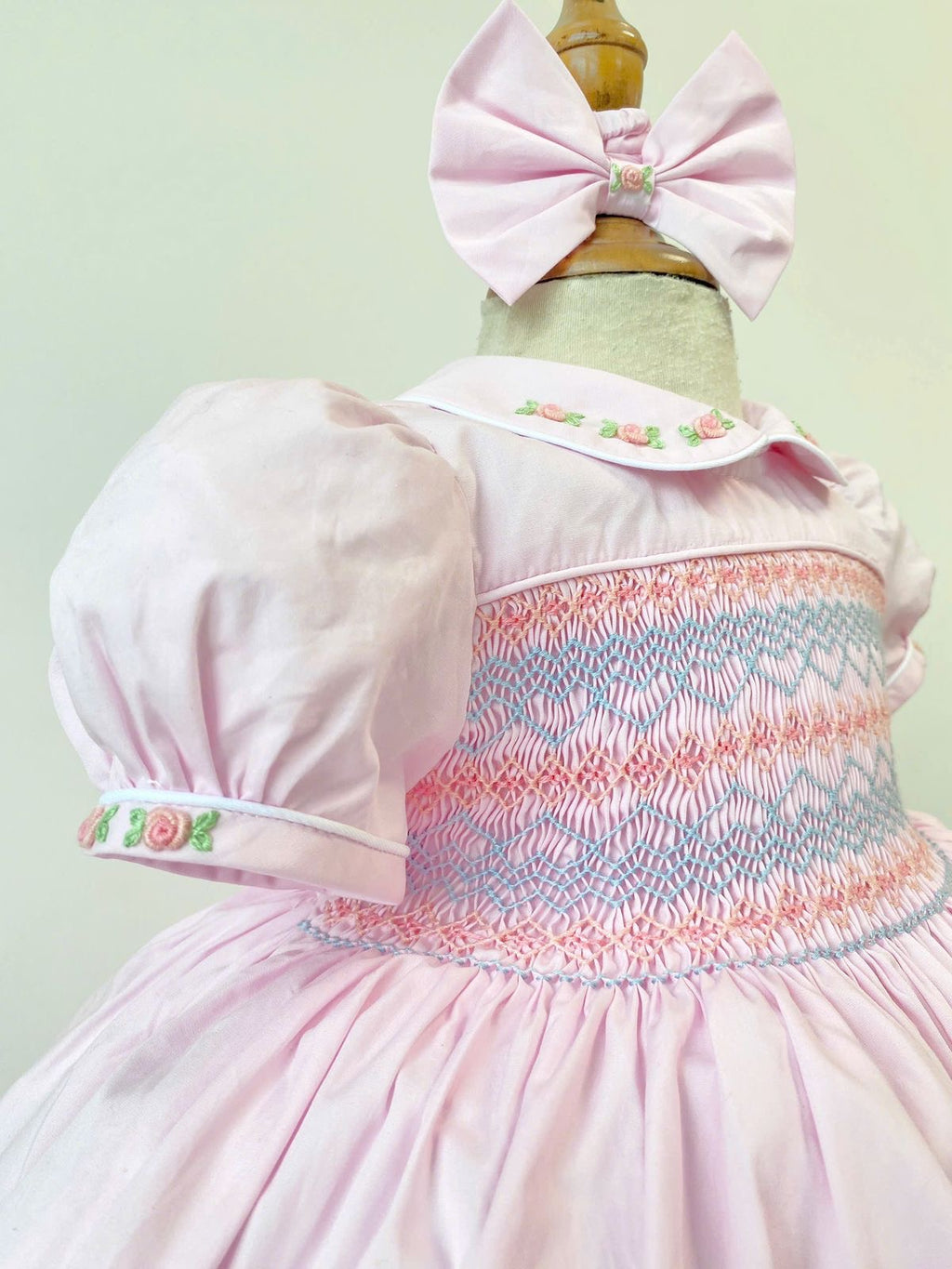 Baby Pink Handsmocked Frock “Poetta” Bows and Bloomers to match.