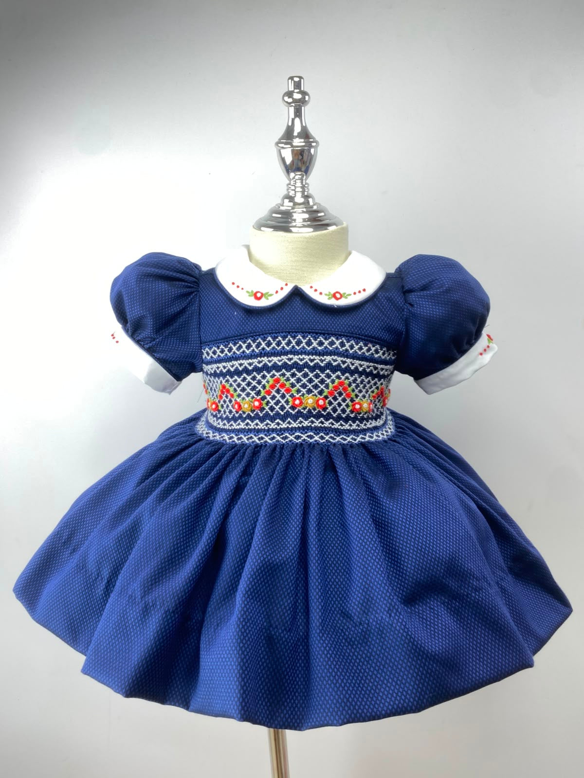 Navy and Red Handsmocked “Snowy” frock. (bows and Bloomers with built in petticoat) 10 day dispatch.