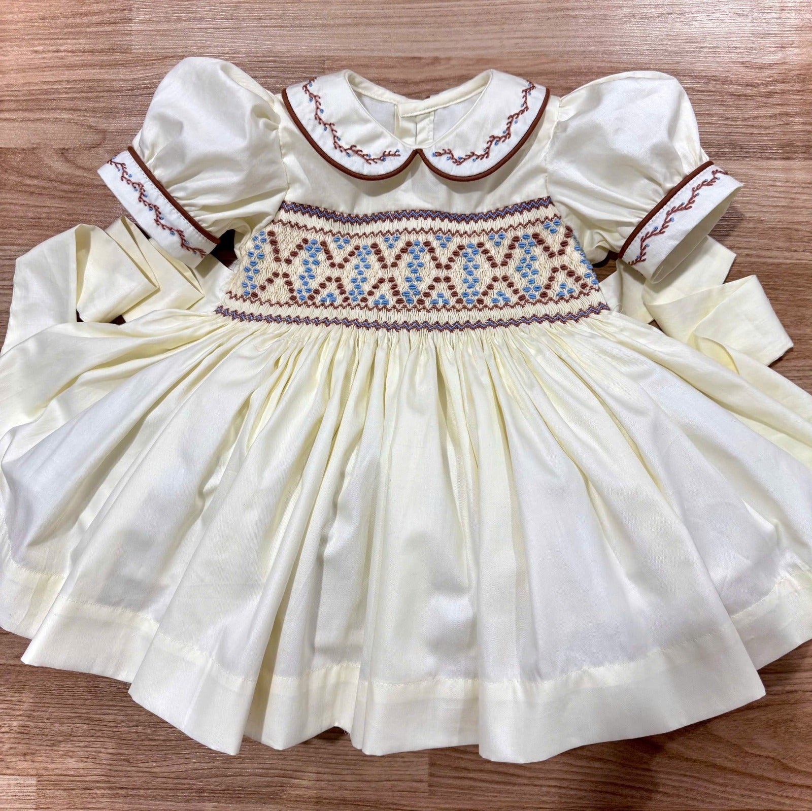 Cream and Brown “Western” handsmocked frock.
