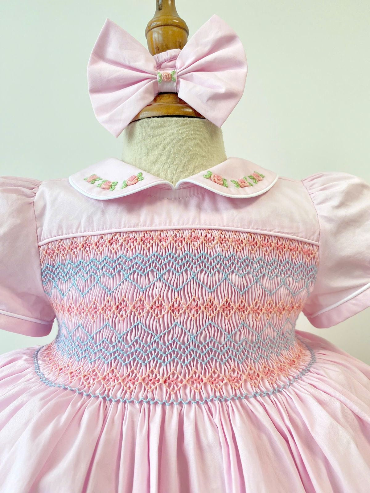 Baby Pink Handsmocked Frock “Poetta” Bows and Bloomers to match.