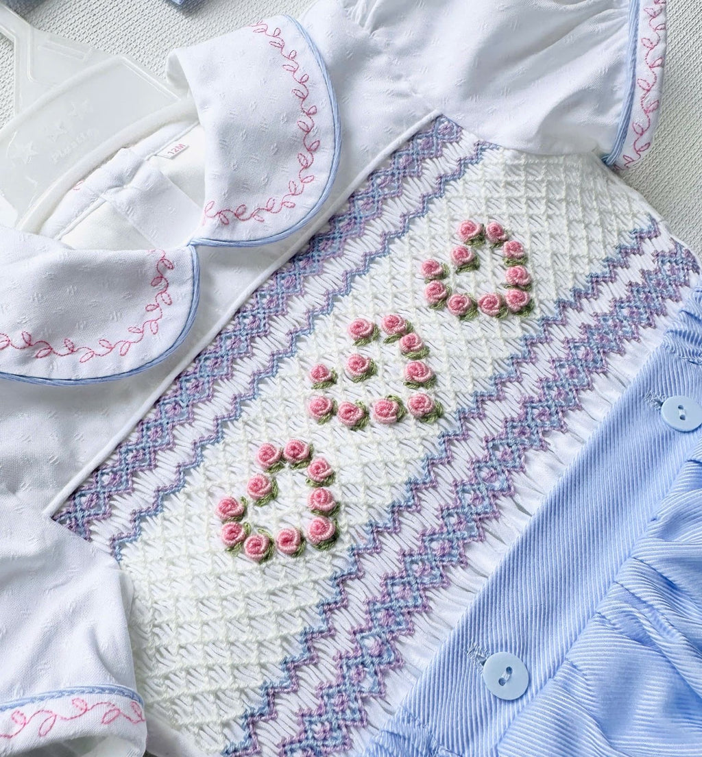 Blue “Lillie” Handsmocked Romper.