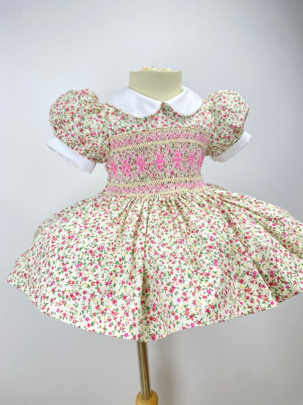 Cream “Florence” Floral Handsmocked Frock.