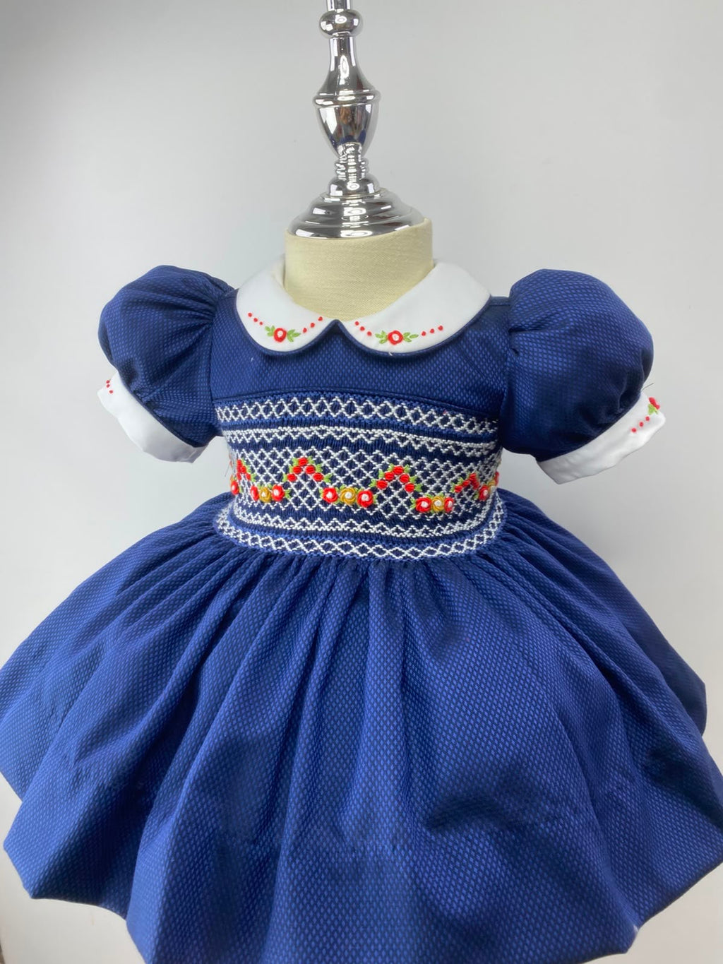 Navy and Red Handsmocked “Snowy” frock. (bows and Bloomers with built in petticoat) 10 day dispatch.