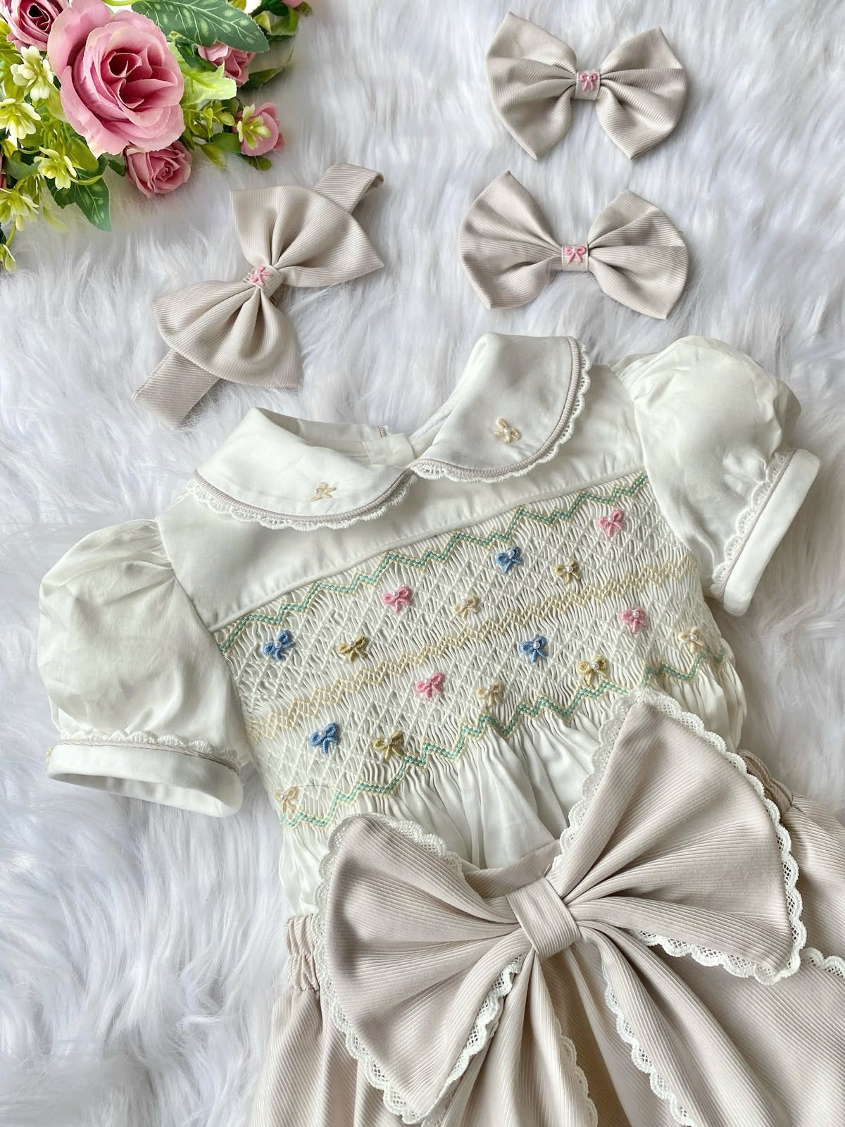 Cream “Vanilla” handsmocked romper. 🍨 (Two week pre order)