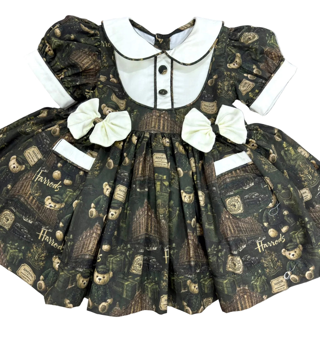Green “Harrods” inspired classic frock. Comes with bows and bloomers. (End of September beginning of October delivery)