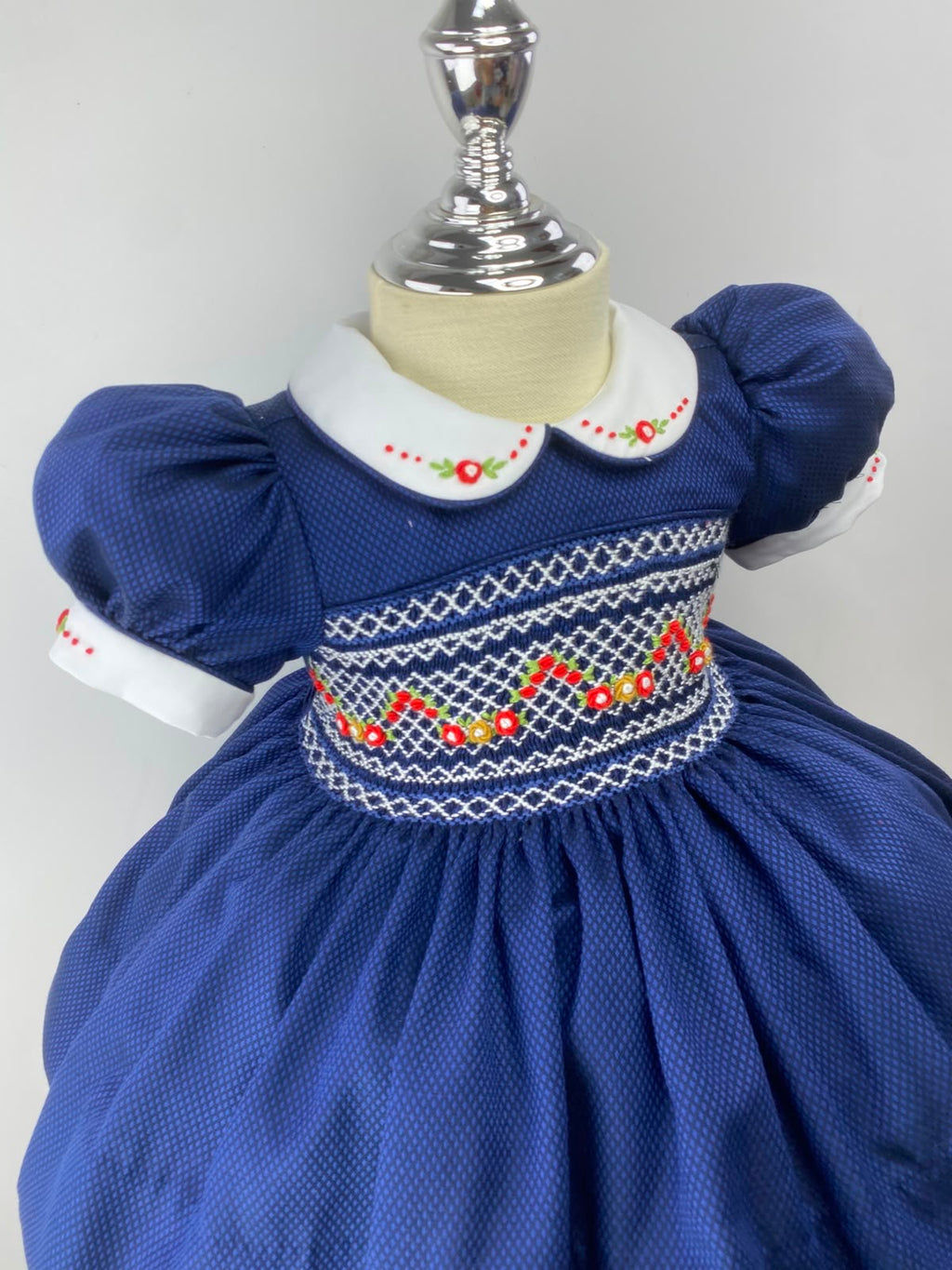 Navy and Red Handsmocked “Snowy” frock. (bows and Bloomers with built in petticoat) 10 day dispatch.