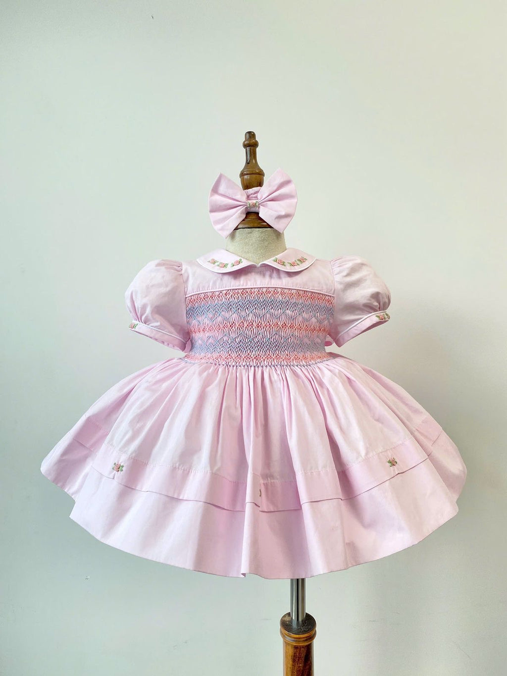Baby Pink Handsmocked Frock “Poetta” Bows and Bloomers to match.