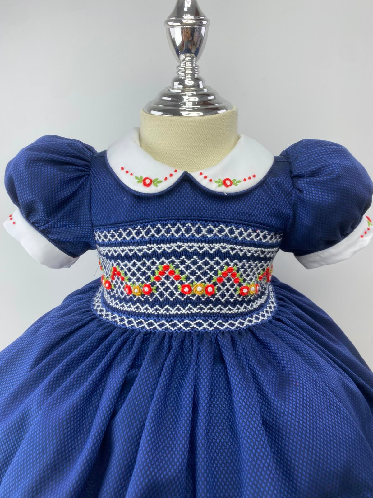 Navy and Red Handsmocked “Snowy” frock. (bows and Bloomers with built in petticoat) 10 day dispatch.