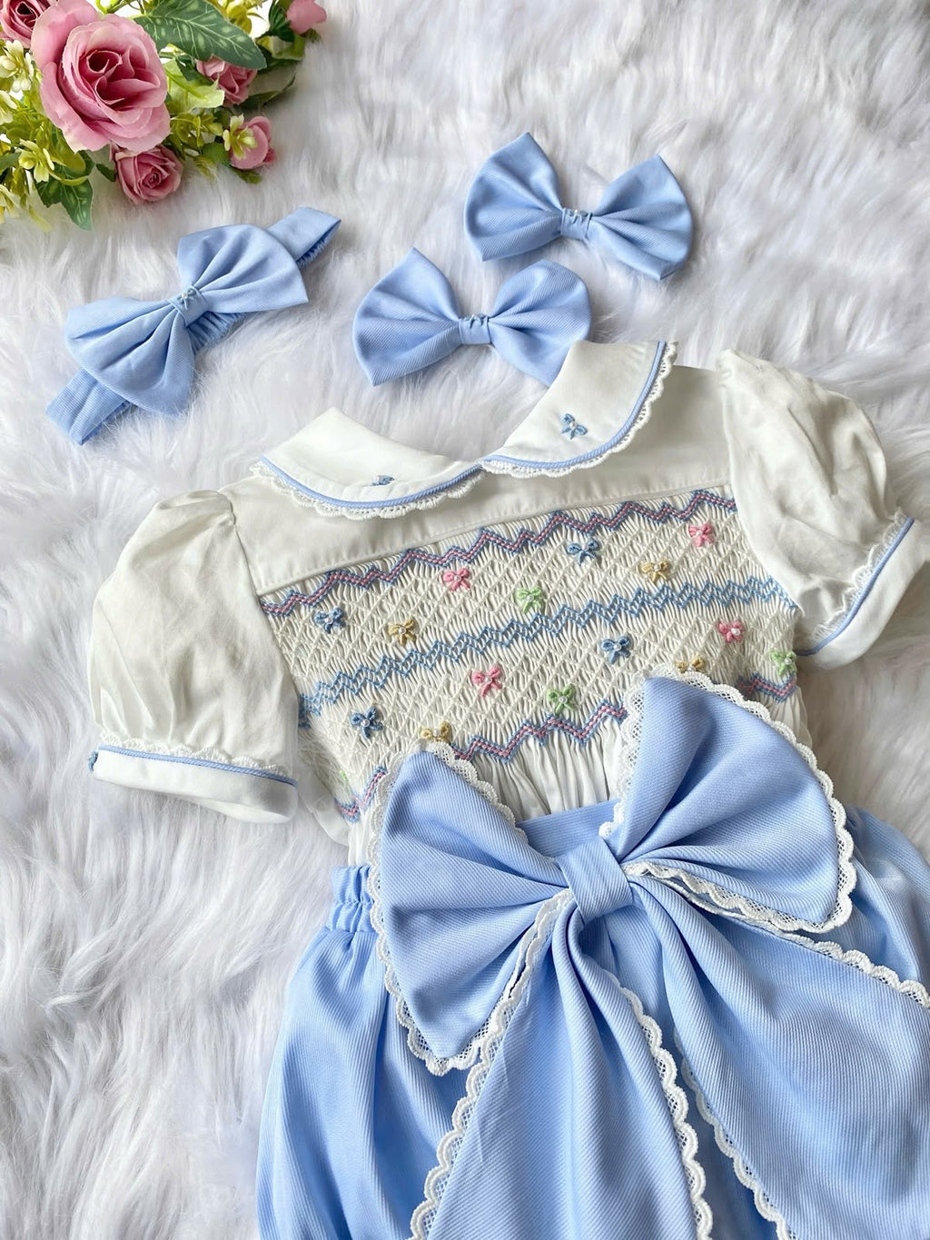 Blue “Bonnie” handsmocked romper (two week pre order)